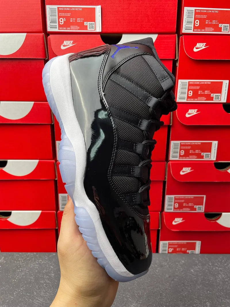 Black high-top sneaker angled view with textured side panels and blue-tinted outsole
