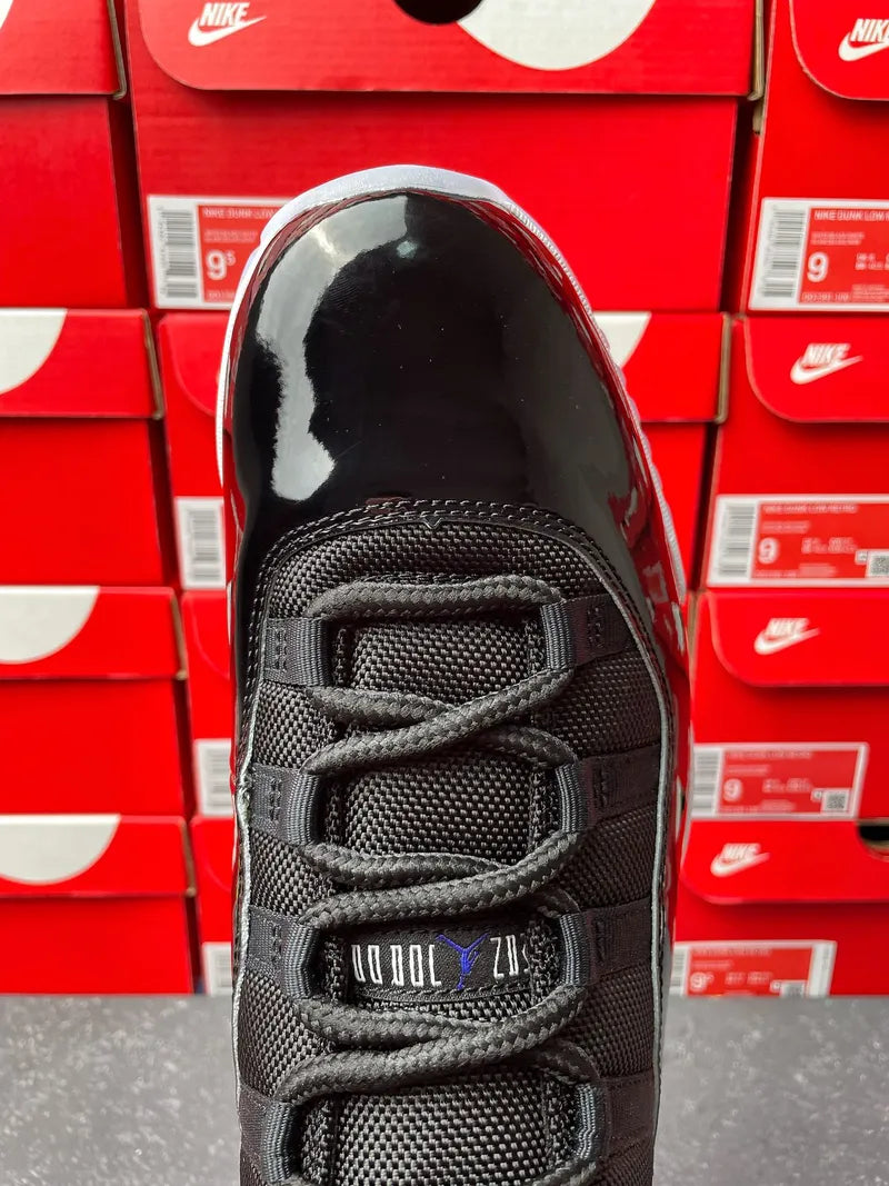 Black high-top sneaker front view with lace eyelets and Jumpman heel detail
