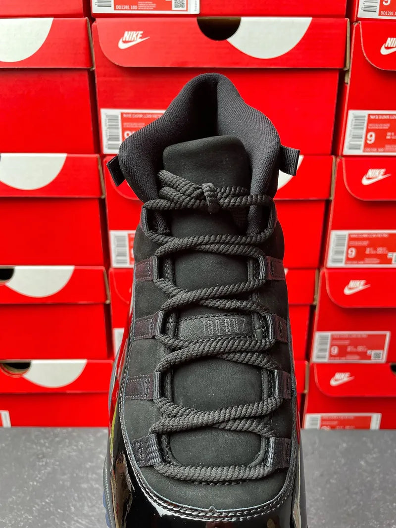 Air Jordan 11 sneaker, black knit tongue and lace-up front with textured midsole