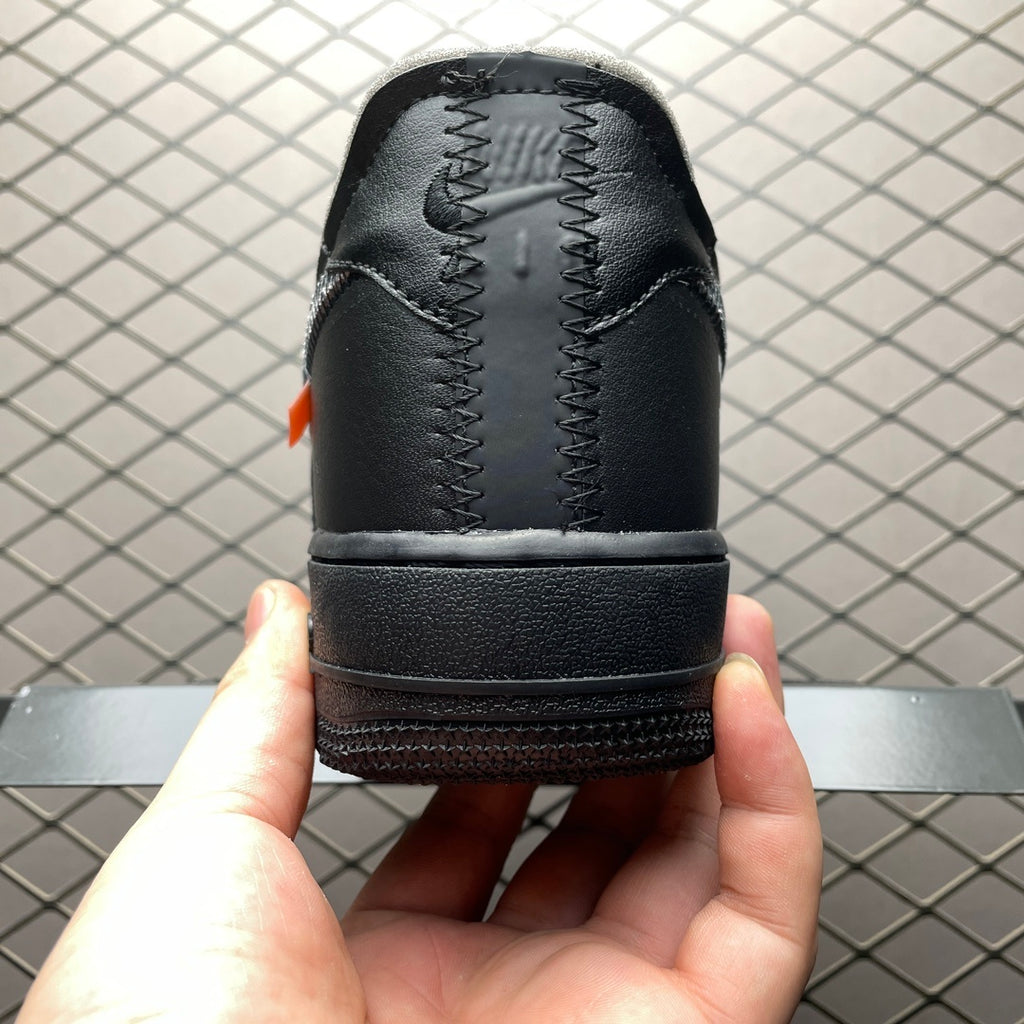 Black sneaker heel with zigzag stitching detail and thick rubber sole