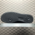 Black rubber outsole with circular traction pattern and textured tread