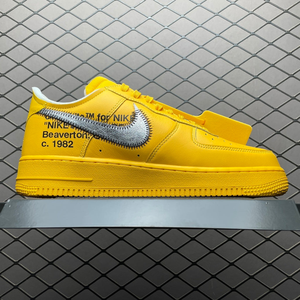 Yellow low-top sneakers with Swoosh logo and “Beaverton, c. 1982” detail on side