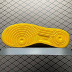 Yellow sneaker outsole with circular traction patterns and Nike logo