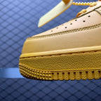 Yellow leather sneaker toe with textured sole edge and small perforation holes