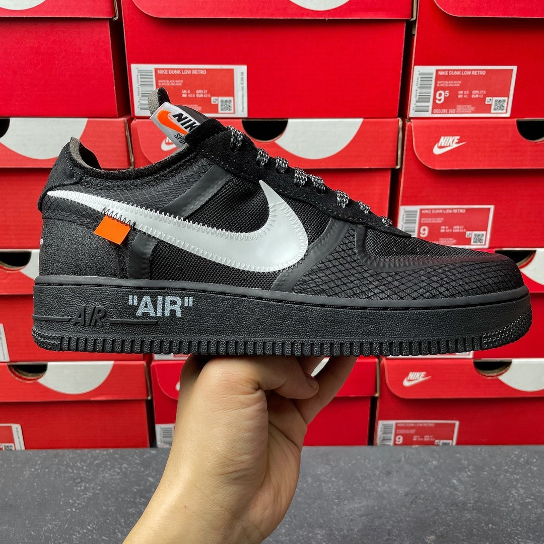Black low-top mesh Air Force 1 sneaker, white swoosh, black laces, rubber sole