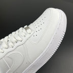 White leather sneakers side view with perforations and lace-up panel