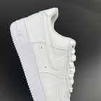 White leather sneakers heel and side profile with lace and stitching details