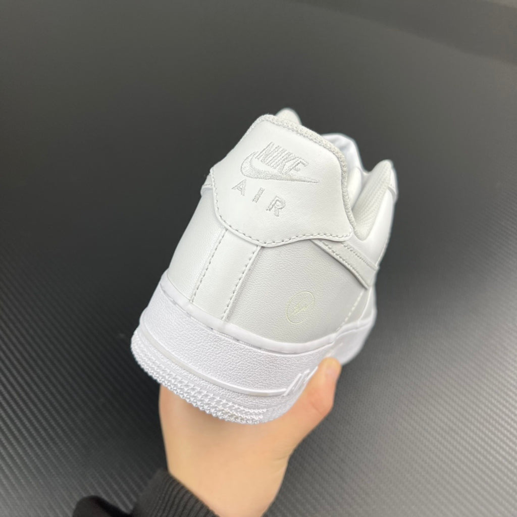White sneaker back view with ankle collar stitching and heel logo detail
