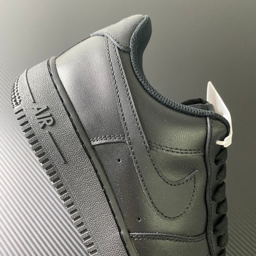 Nike Air Force 1 sneakers, close-up of heel and collar with lace-up closure, dark.