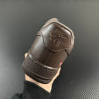 Taupe low-top sneaker heel with cushioned collar and 'NIKE AIR' tab.