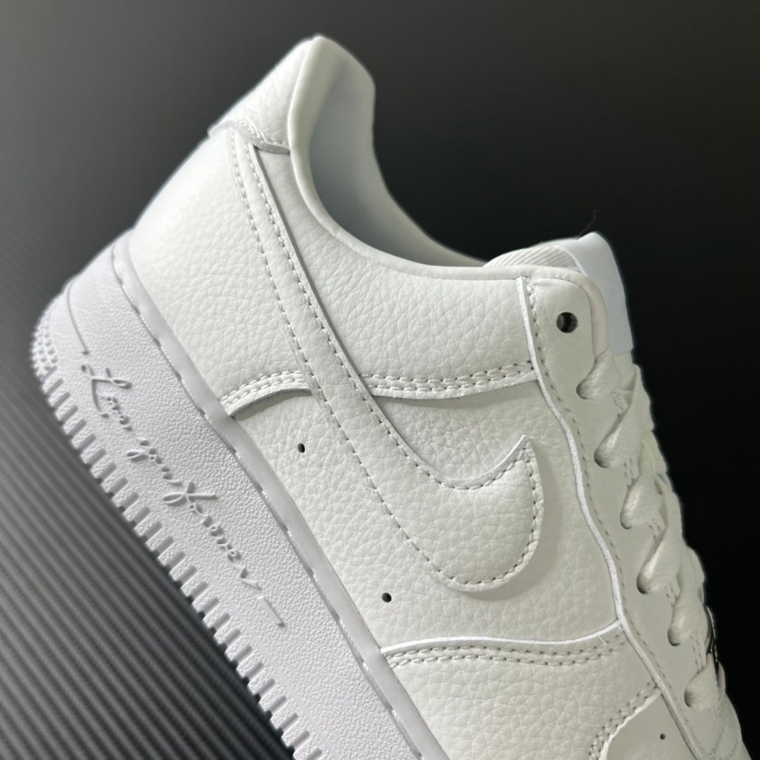 White sneaker side view with stitched overlays, lace eyelets, and padded collar
