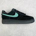 Air Force 1 sneaker in black with teal swoosh and lace-up front.