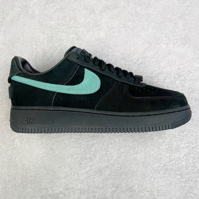 Air Force 1 sneaker in black with teal swoosh and lace-up front.