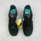 Pair of black Air Force 1 sneakers with teal lining and Tiffany-branded tongue.