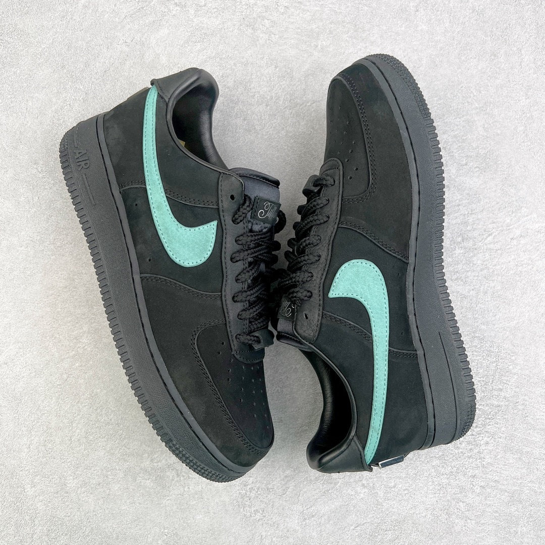 Air Force 1 sneaker angled view in dark gray with teal swoosh and black laces.
