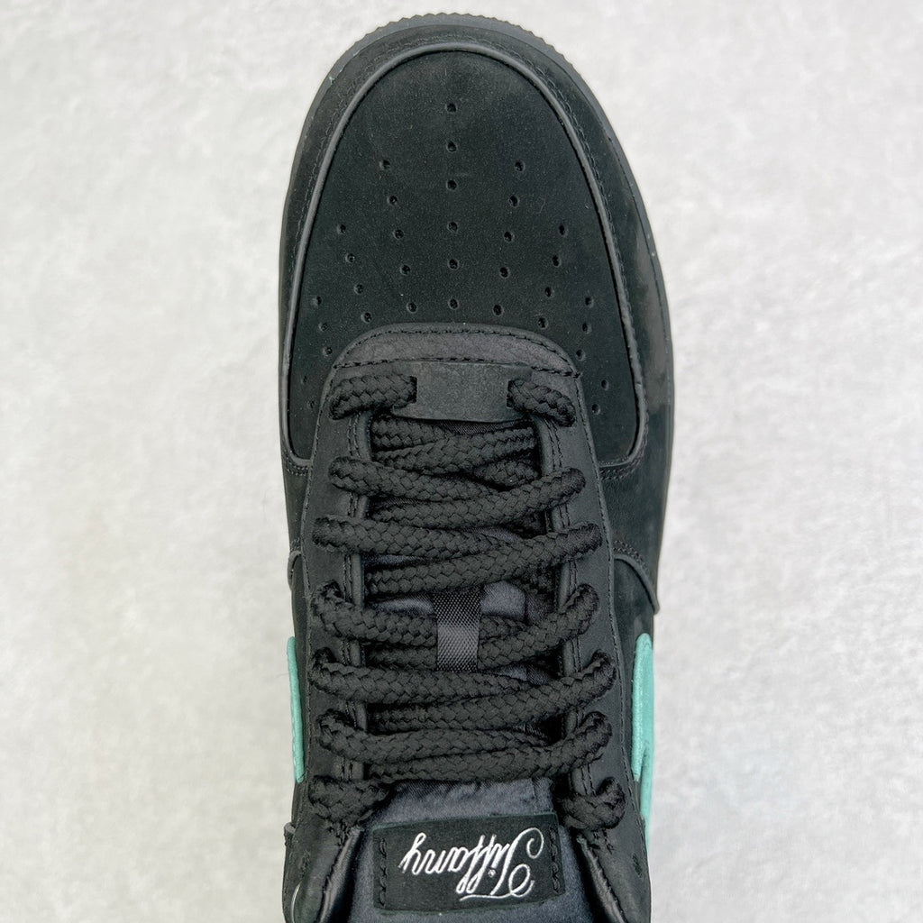 Air Force 1 toe and lace area in black with teal panel on upper.