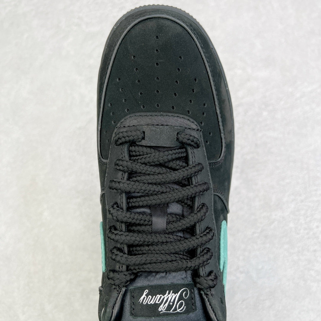 Air Force 1 toe and lace area in black with teal panel on upper.