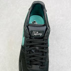 Air Force 1 tongue close-up in black with Tiffany logo patch and teal interior.