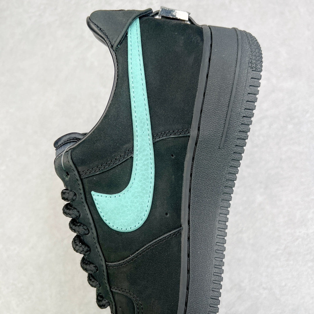 Air Force 1 sneaker side view with black panels and teal swoosh stripe.