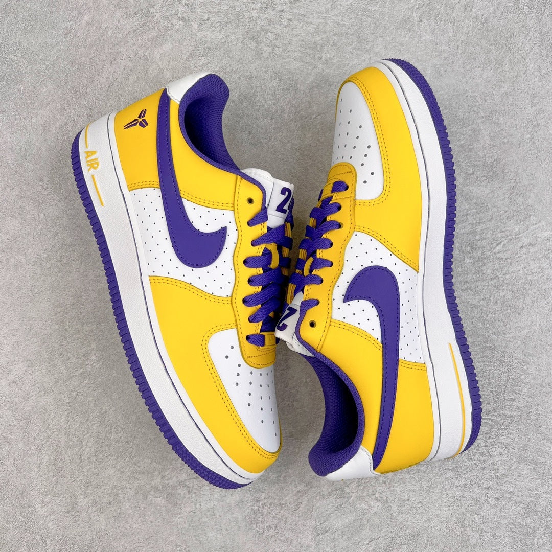 Yellow and white low-top sneakers with purple swoosh, lace-up front, and Air text