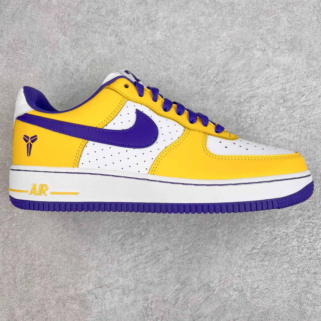 Yellow, white, and purple low-top sneakers with swoosh logo and lace-up closure