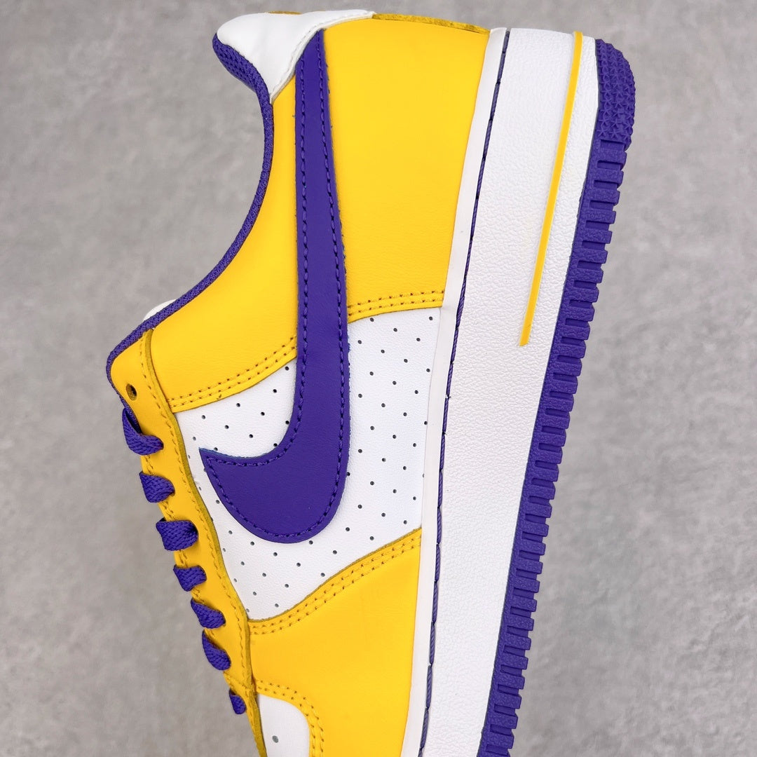 Yellow sneaker with purple swoosh, white midsole, and perforated toe