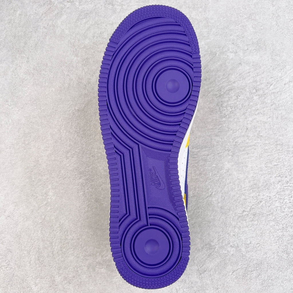 Purple rubber outsole with circular traction pattern and molded channels