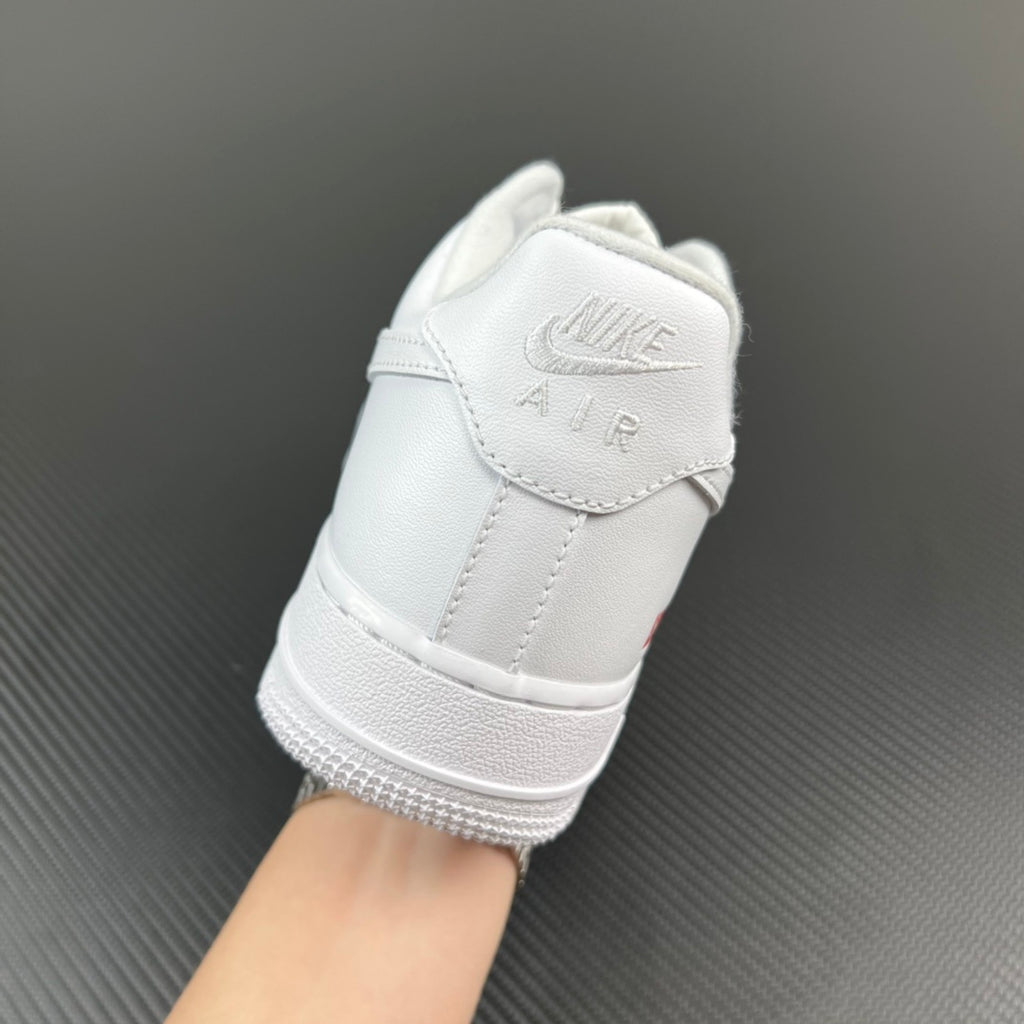 White leather sneaker with Nike Air logo on back tab