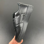 Black leather high-traction sneakers shown from side with thick rubber outsole