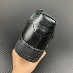 Black leather sneakers heel view with embossed logo and textured rubber sole