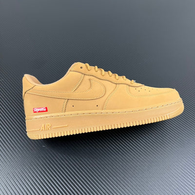 Yellow suede Air Force 1 low-top sneaker with Supreme patch on side