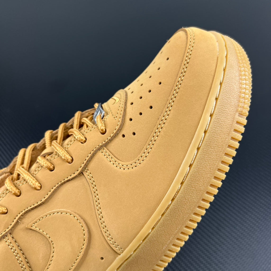 Yellow Air Force 1 sneaker with perforated toe and side swoosh detail