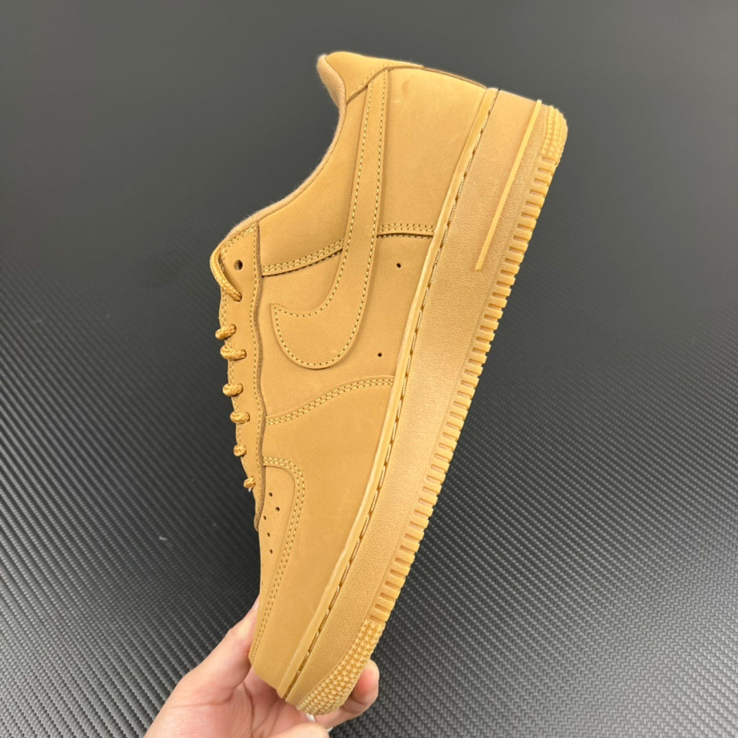 Yellow Air Force 1 sneaker side view with swoosh and lace eyelets