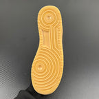 Yellow rubber Air Force 1 outsole tread with circular traction grooves