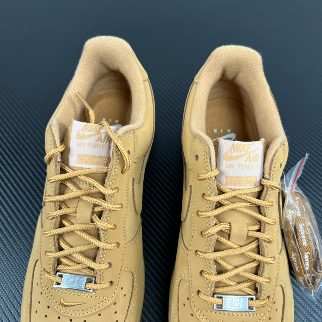 Pair of yellow Air Force 1 sneakers showing cushioned tongues and lace-up collar