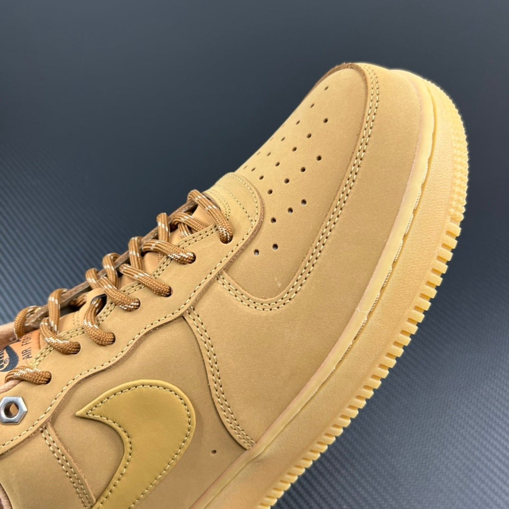 Tan/yellow suede sneaker side view with lace eyelets and cushioned sole