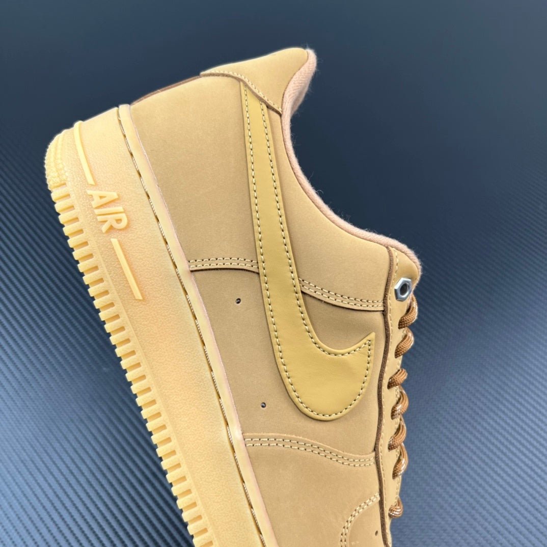 Tan/yellow Nike Air Force 1-style sneaker heel and side panel detail