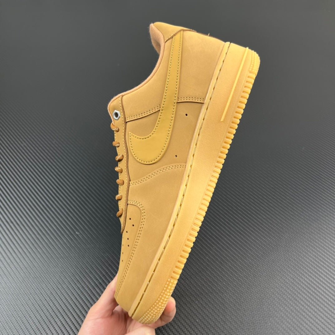 Tan/yellow suede high-top sneaker with lace-up front and thick sole