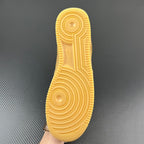 Tan/yellow rubber outsole with circular traction pattern
