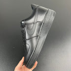 FRGMT Air Force 1 low-top sneaker, metallic silver side on outsole, held in hand