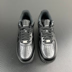 FRGMT Air Force 1 low-top sneaker pair, dark uppers with silver toe caps and lace panels