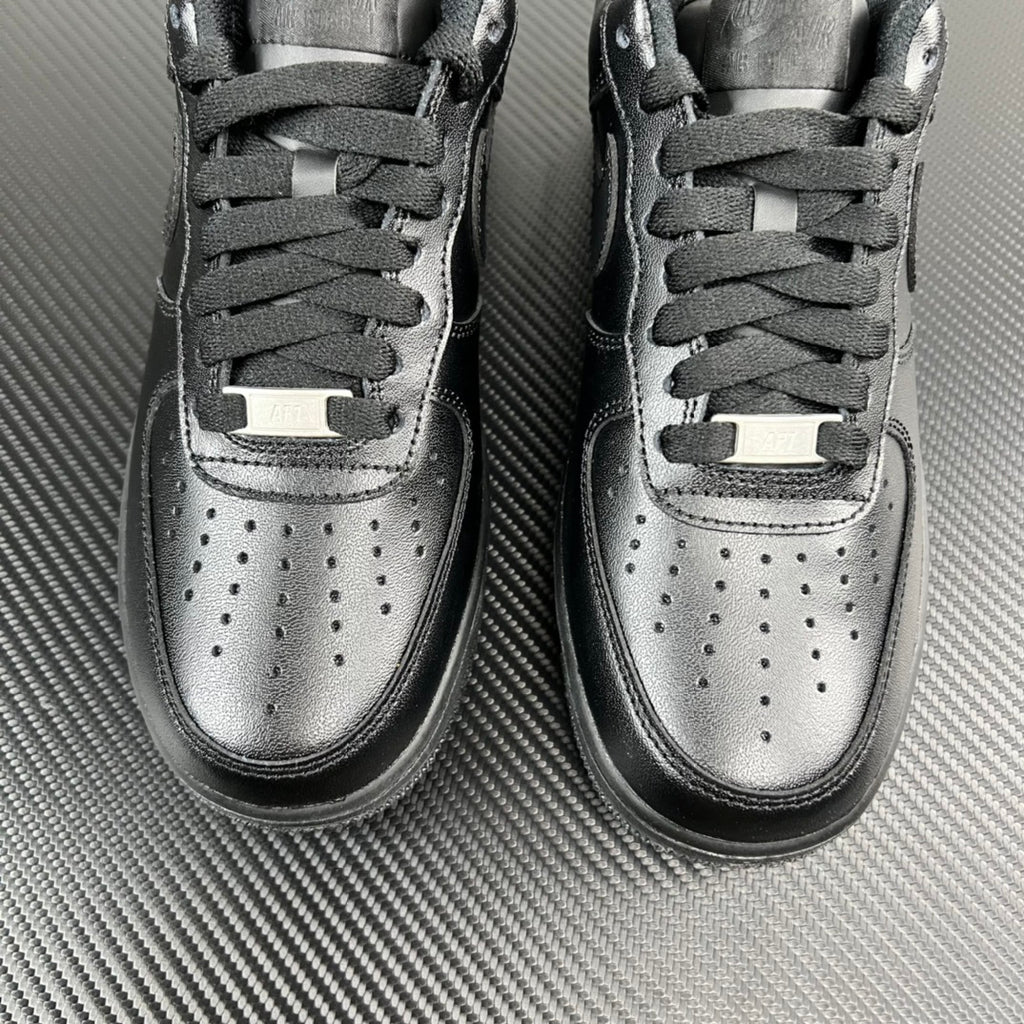 FRGMT Air Force 1 sneaker pair, dark uppers with silver toe caps and lace stays