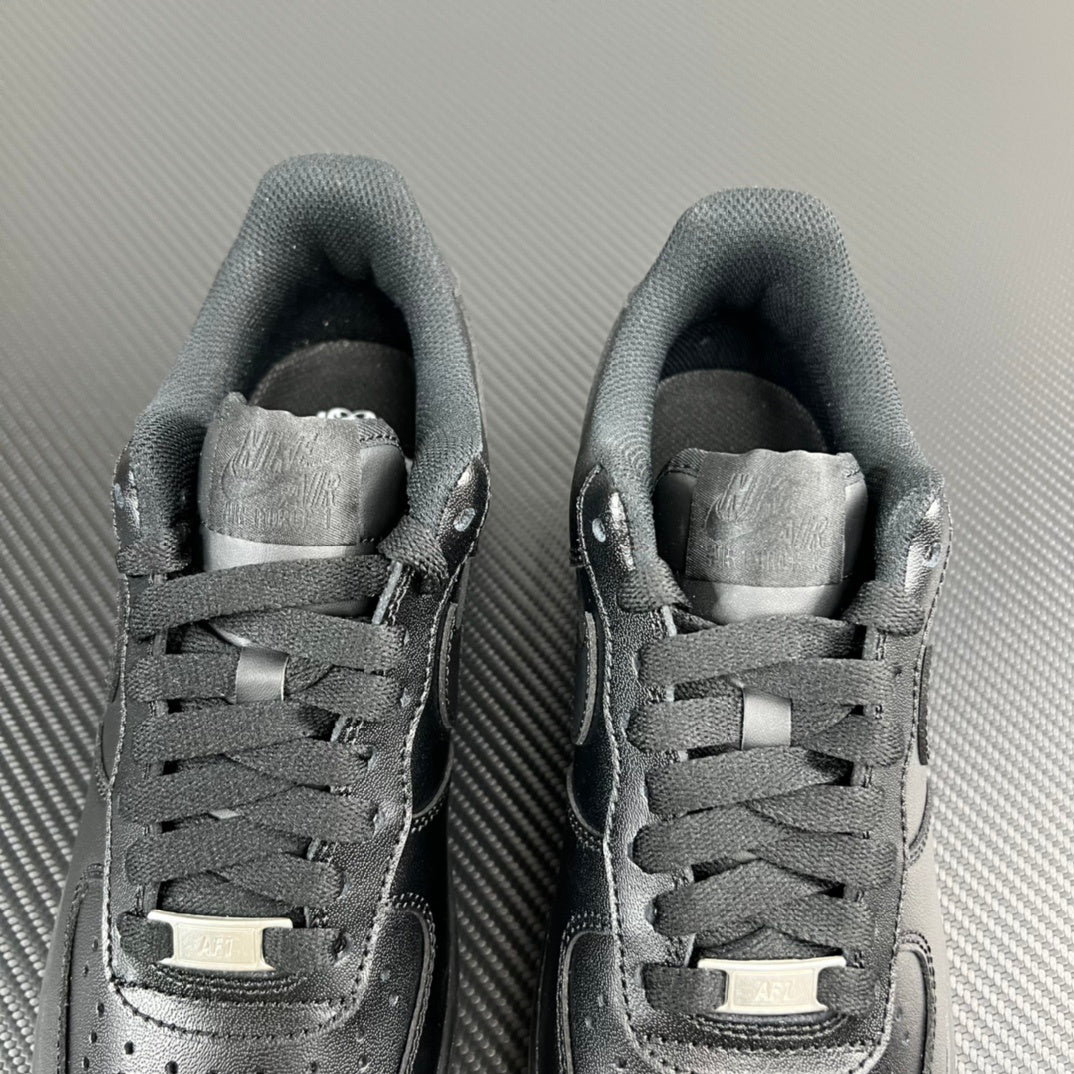 FRGMT Air Force 1 sneaker pair, dark uppers with silver toe caps and lace bars