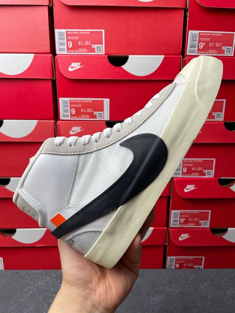 Off-white high-top sneakers with black swoosh, orange tag, and beige midsole