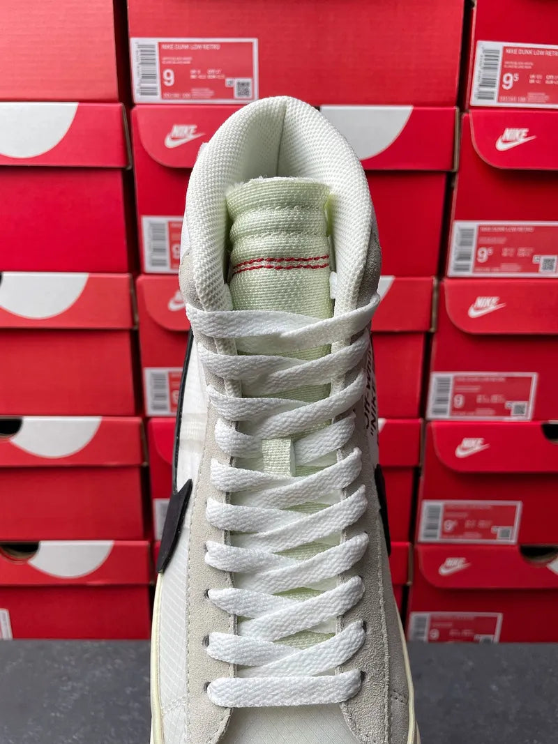 Off-white high-top sneakers heel view with white laces and cushioned collar