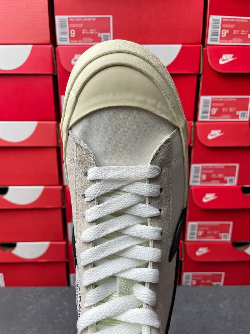 Off-white high-top sneakers front view with white laces and gray side panels