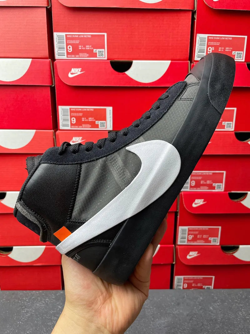 Black Nike high-top sneaker with white swoosh and side view, lace-up