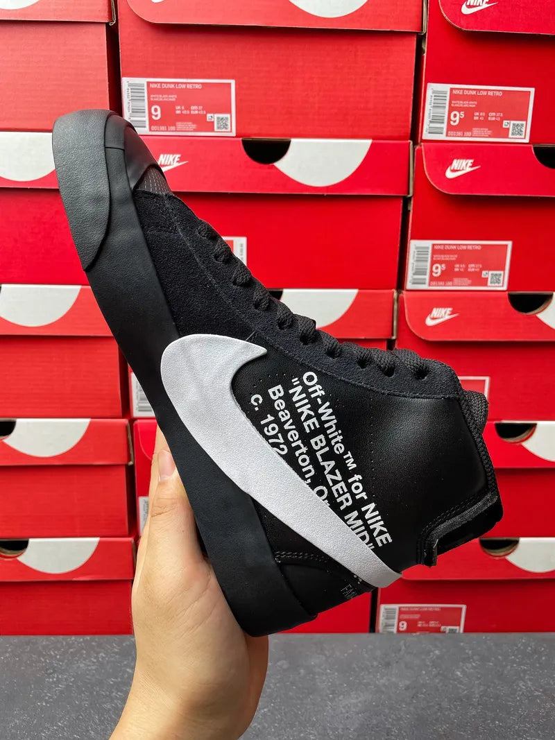 Black Nike high-top sneaker with white swoosh and printed text on side
