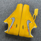 Yellow Air Force 1 sneakers with white swooshes and 'AIR' branding on quarter panels