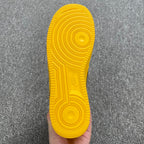 Yellow Air Force 1 rubber outsole with circular traction pattern